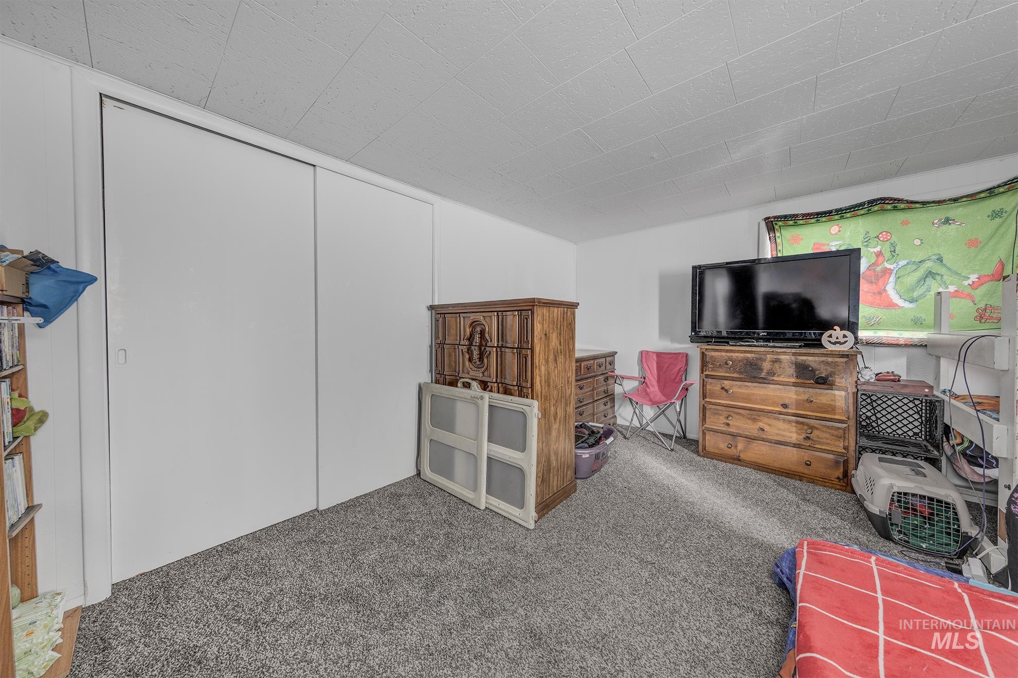 Bedroom featuring a closet and carpet